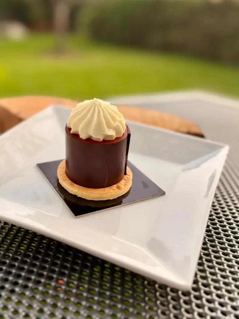 Koňaková špička, a chocolate cognac cream pastry with a cream swirl
