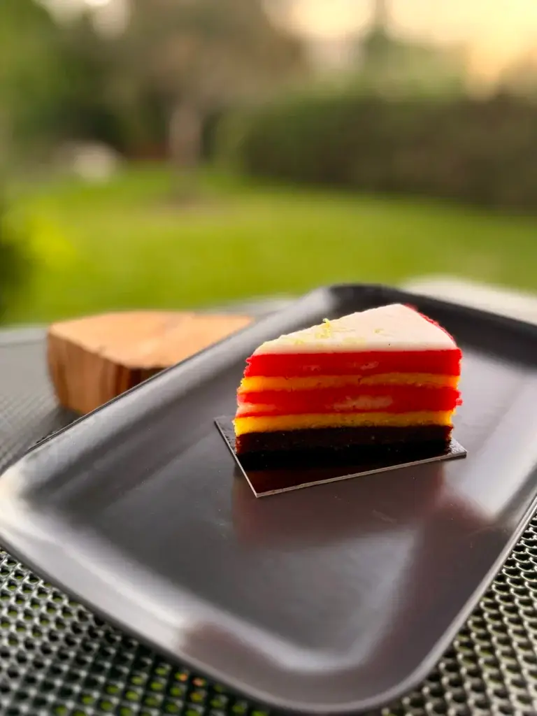 Punčák, a Czech punch slice with red and yellow sponge layers